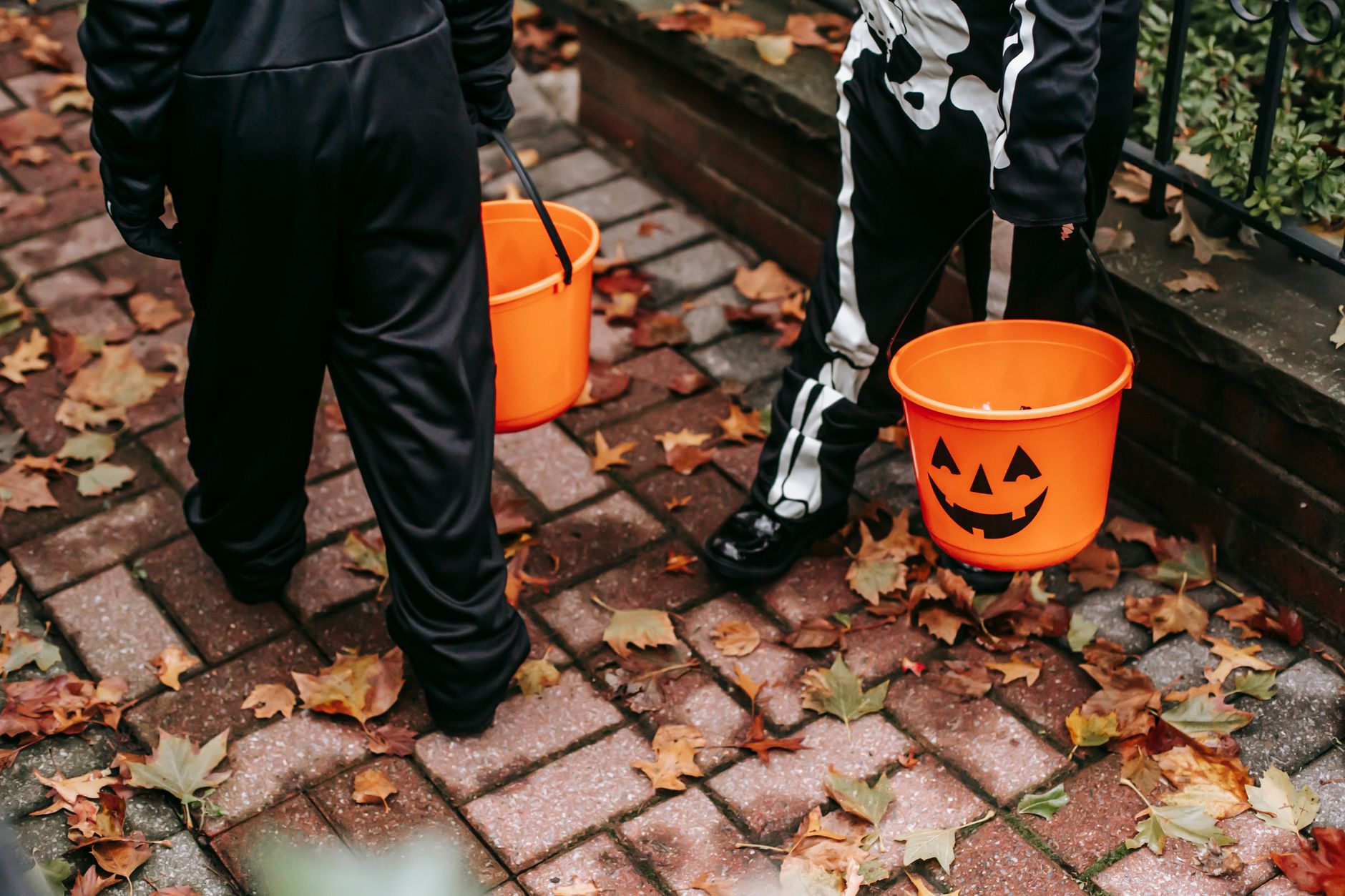 Trick-or-treaters collecting candy at the door